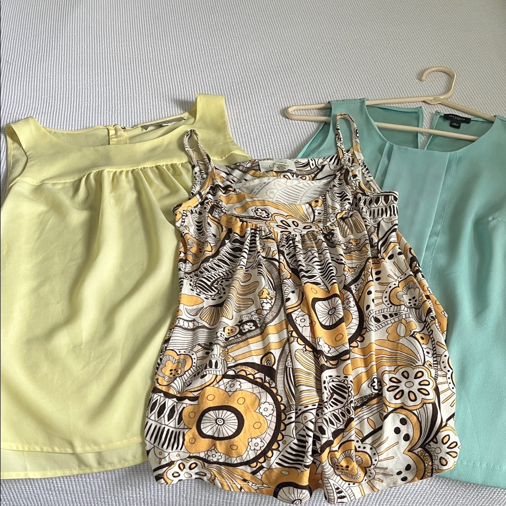 Three sleeveless blouses